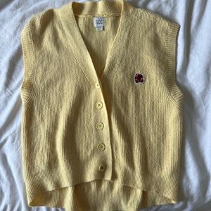 yellow sweater vest